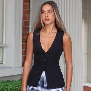 White Fox black vest